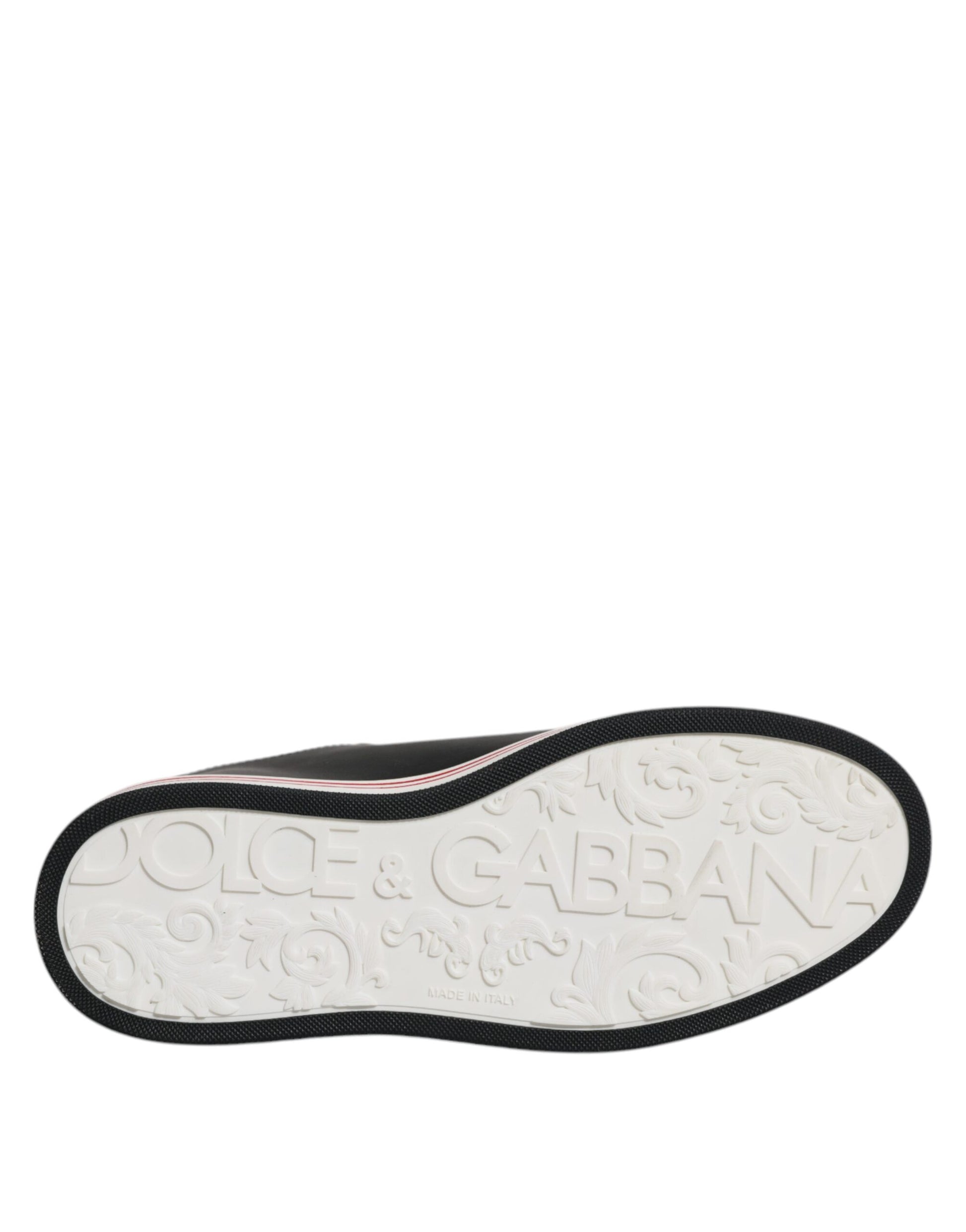 White sneaker with black laces and a red logo on the side