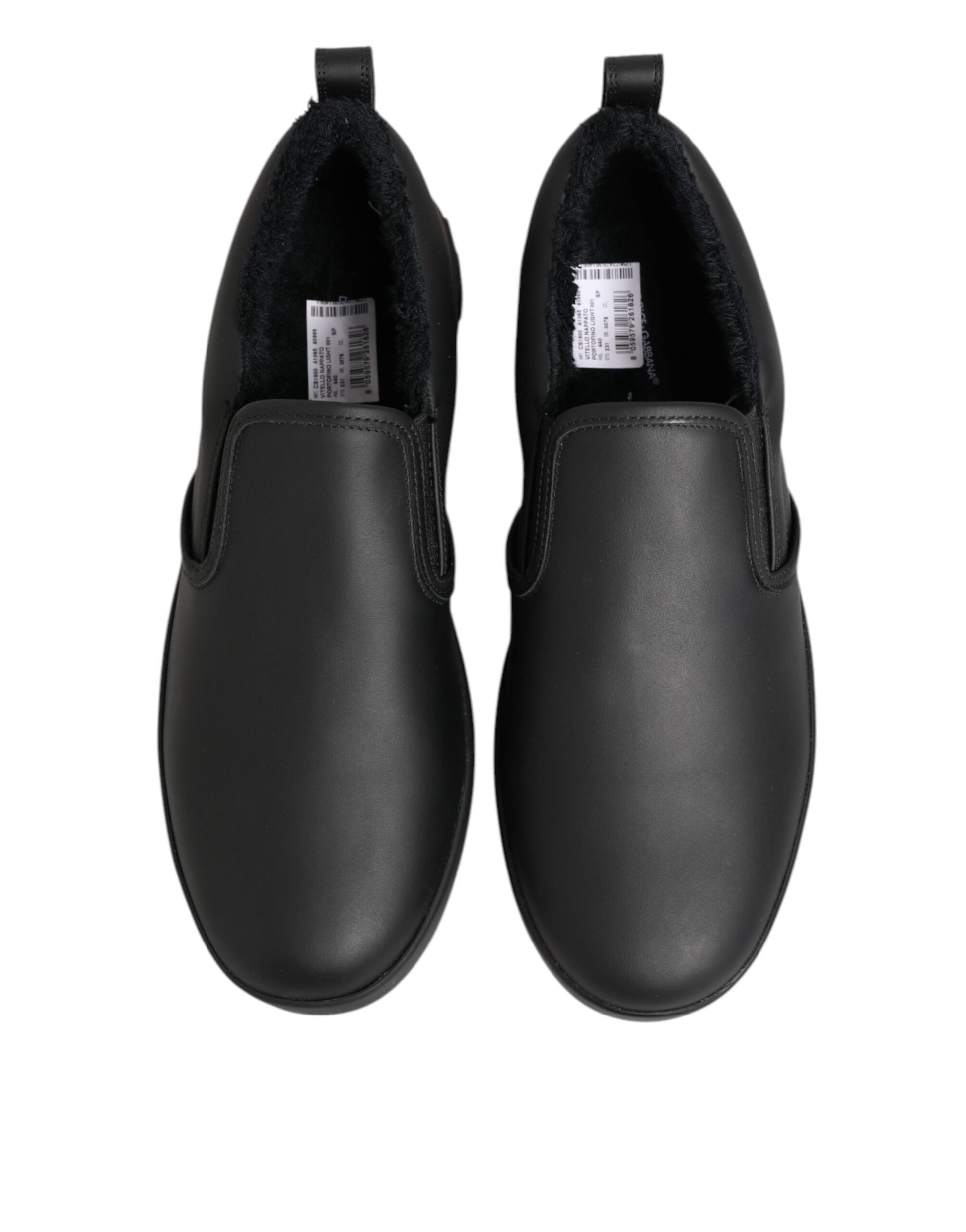 Pair of black shoes with white soles