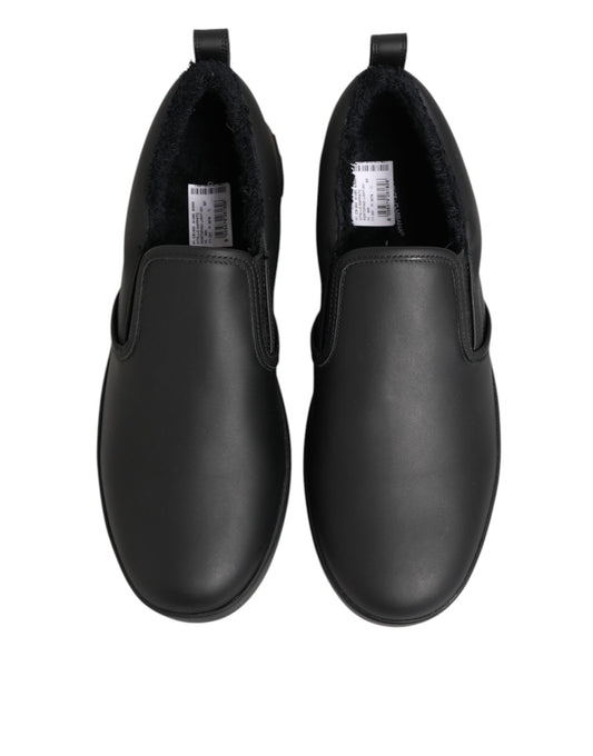 Pair of black shoes with white soles