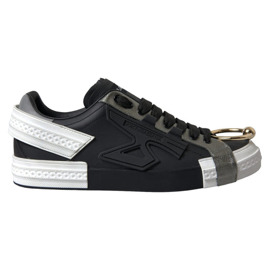 Black sneaker with white sole and gold zipper pull