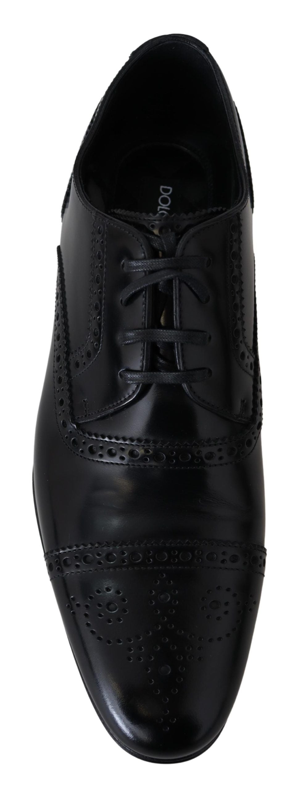 Black dress shoe with laces and patterned design on side
