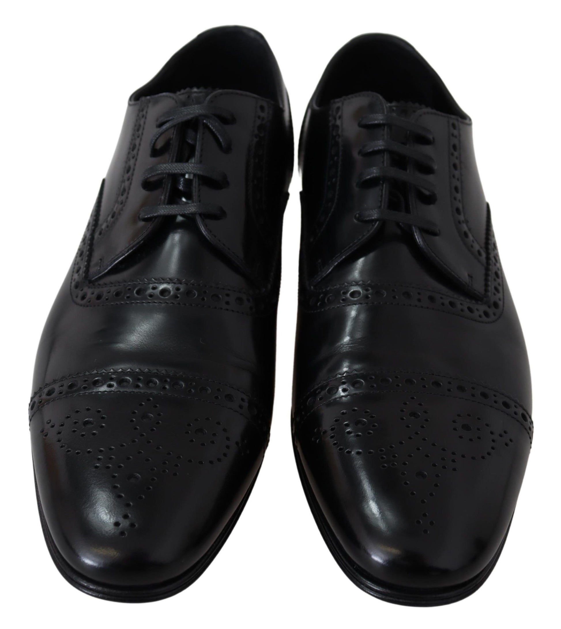 Pair of black dress shoes with laces and perforated design on toe caps