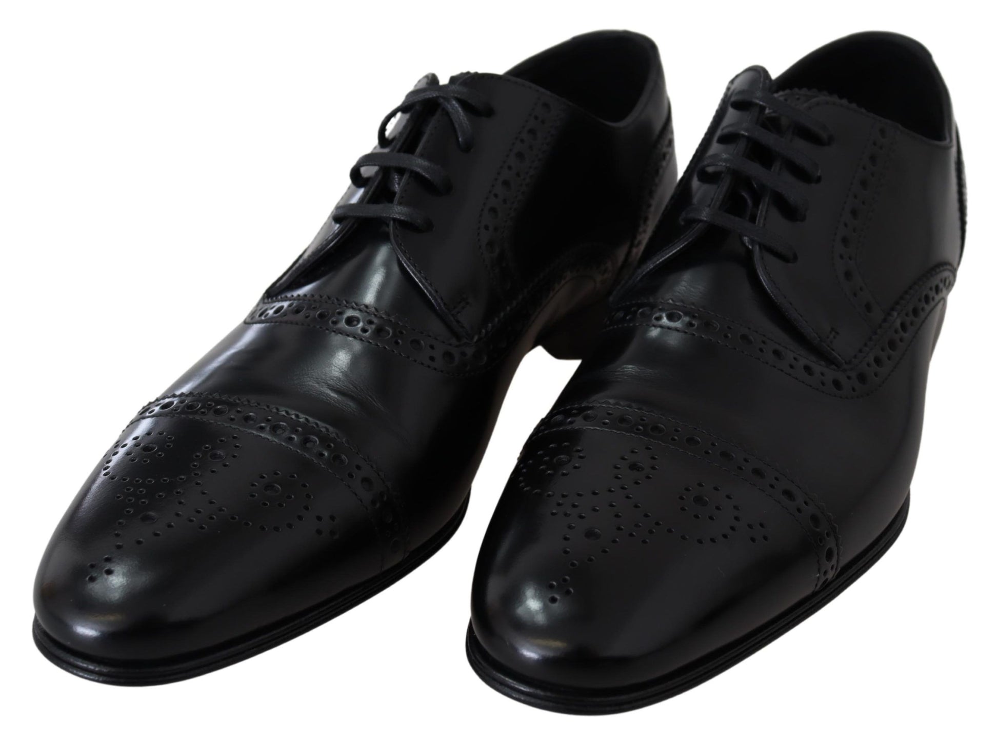 Pair of black dress shoes with laces and perforated design