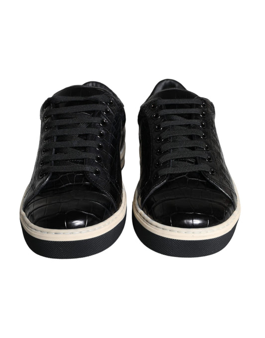 Pair of black sneakers with white soles and laces