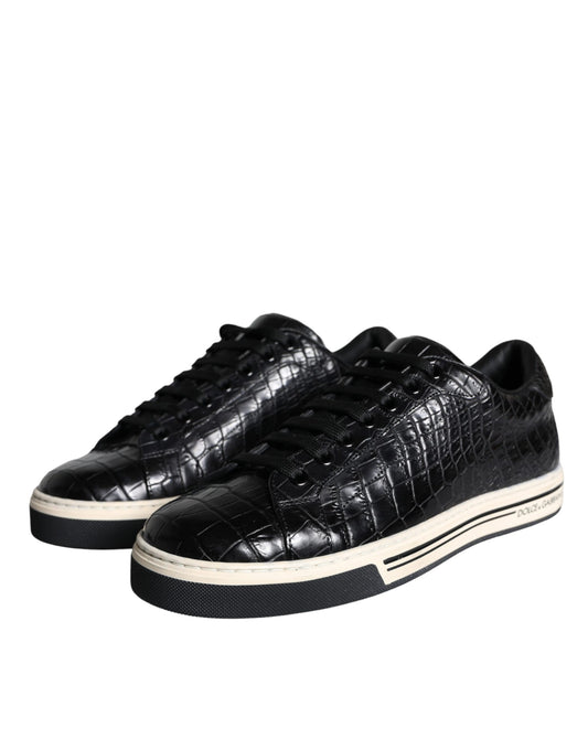 Pair of black sneakers with white soles and laces