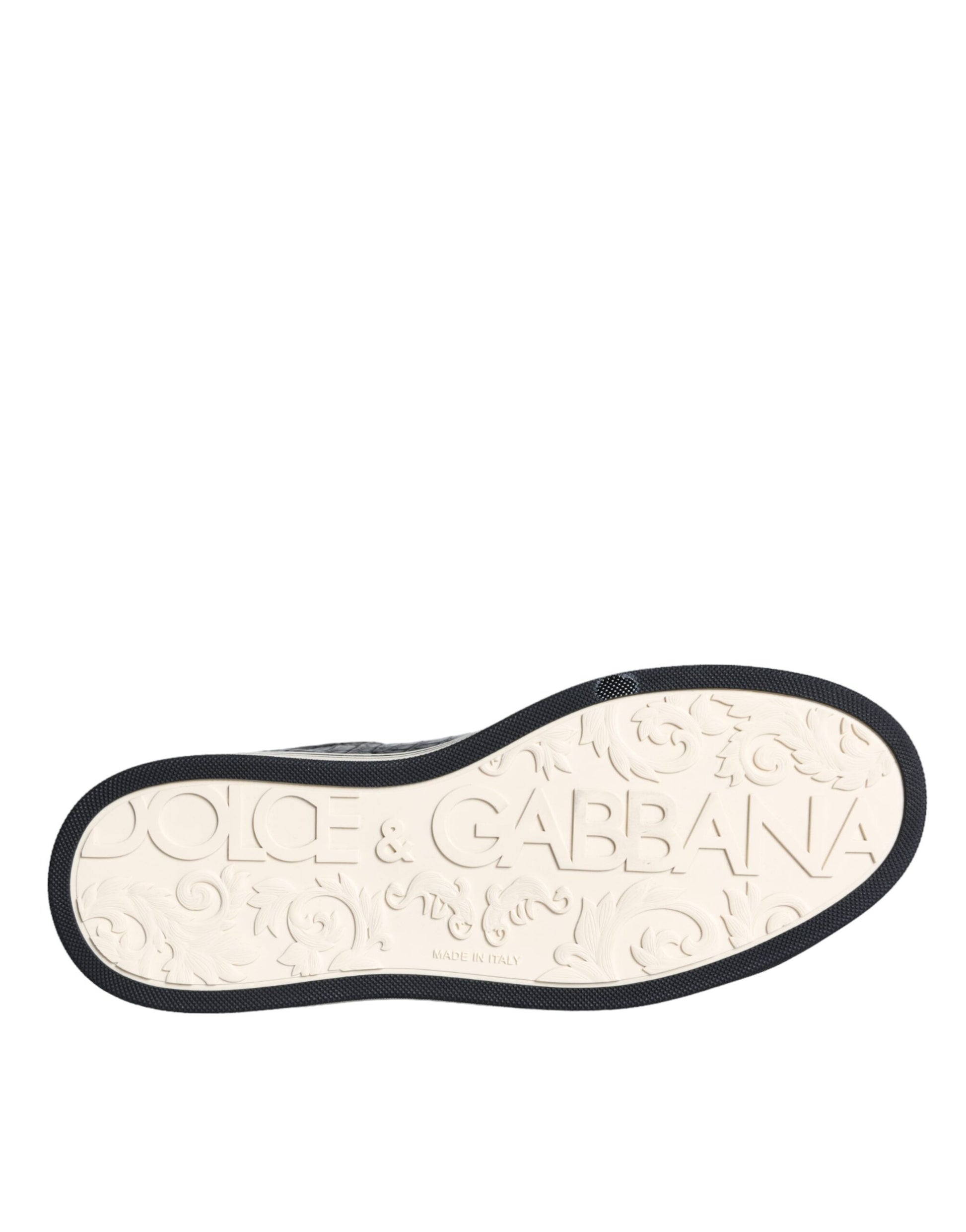 Shoe with black strap and gold lettering on sole