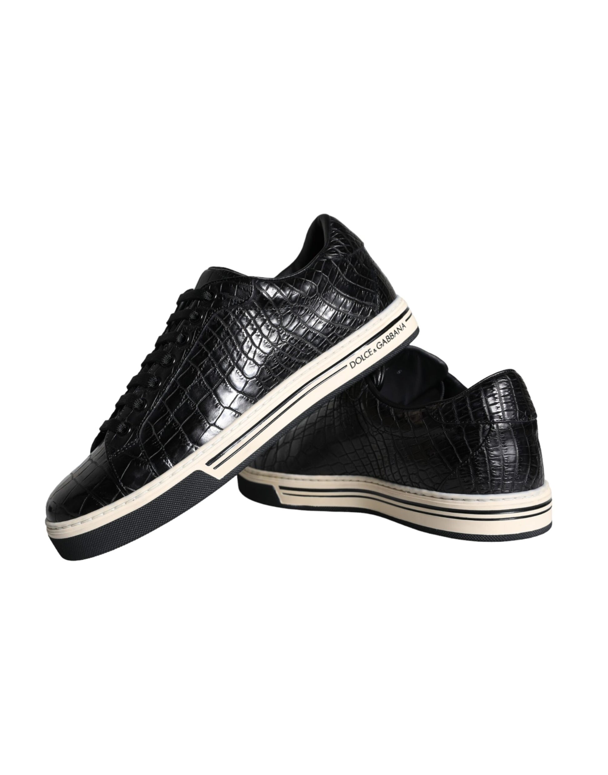 Pair of black sneakers with white sole and laces