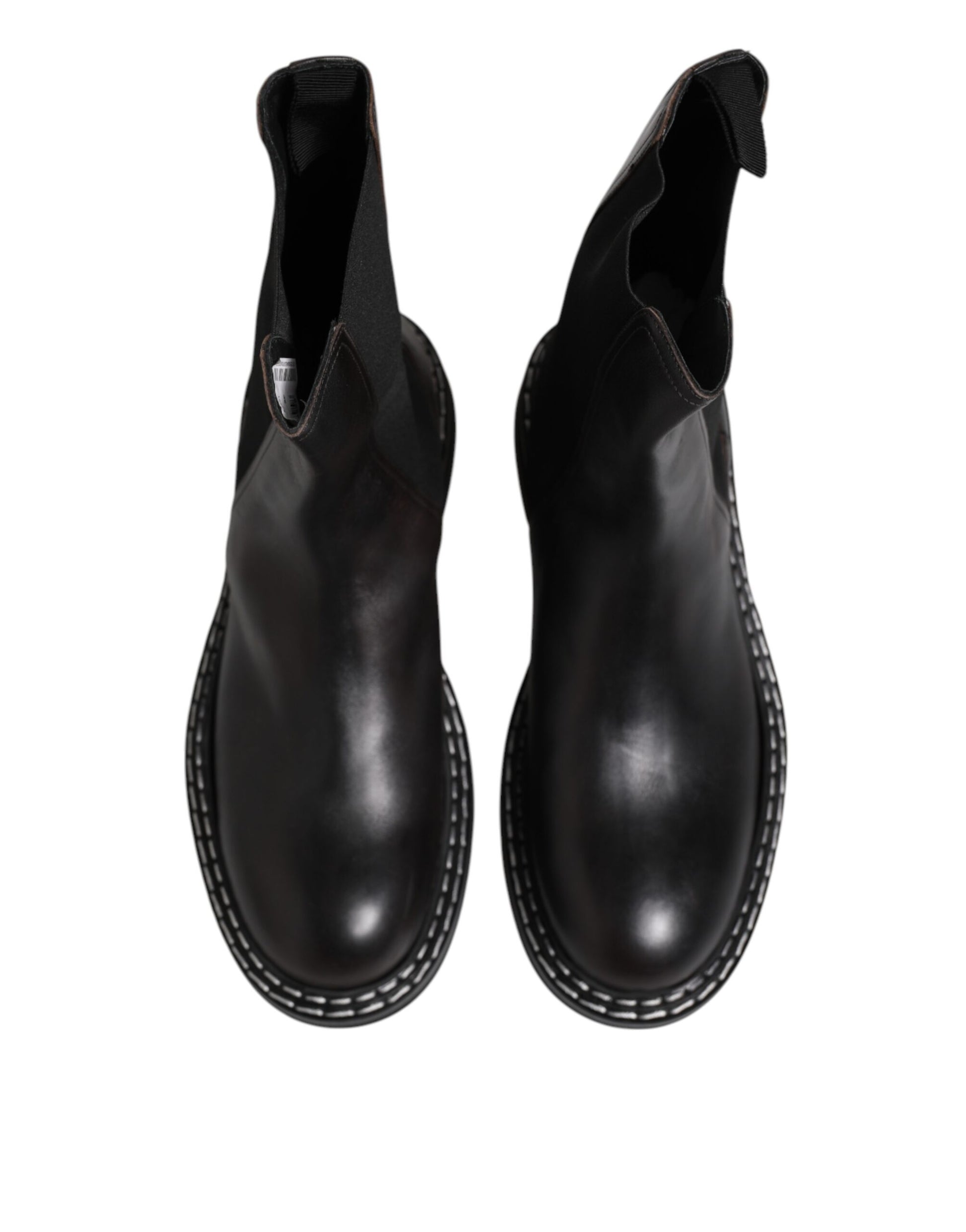 Pair of black leather boots with laces and stitching details