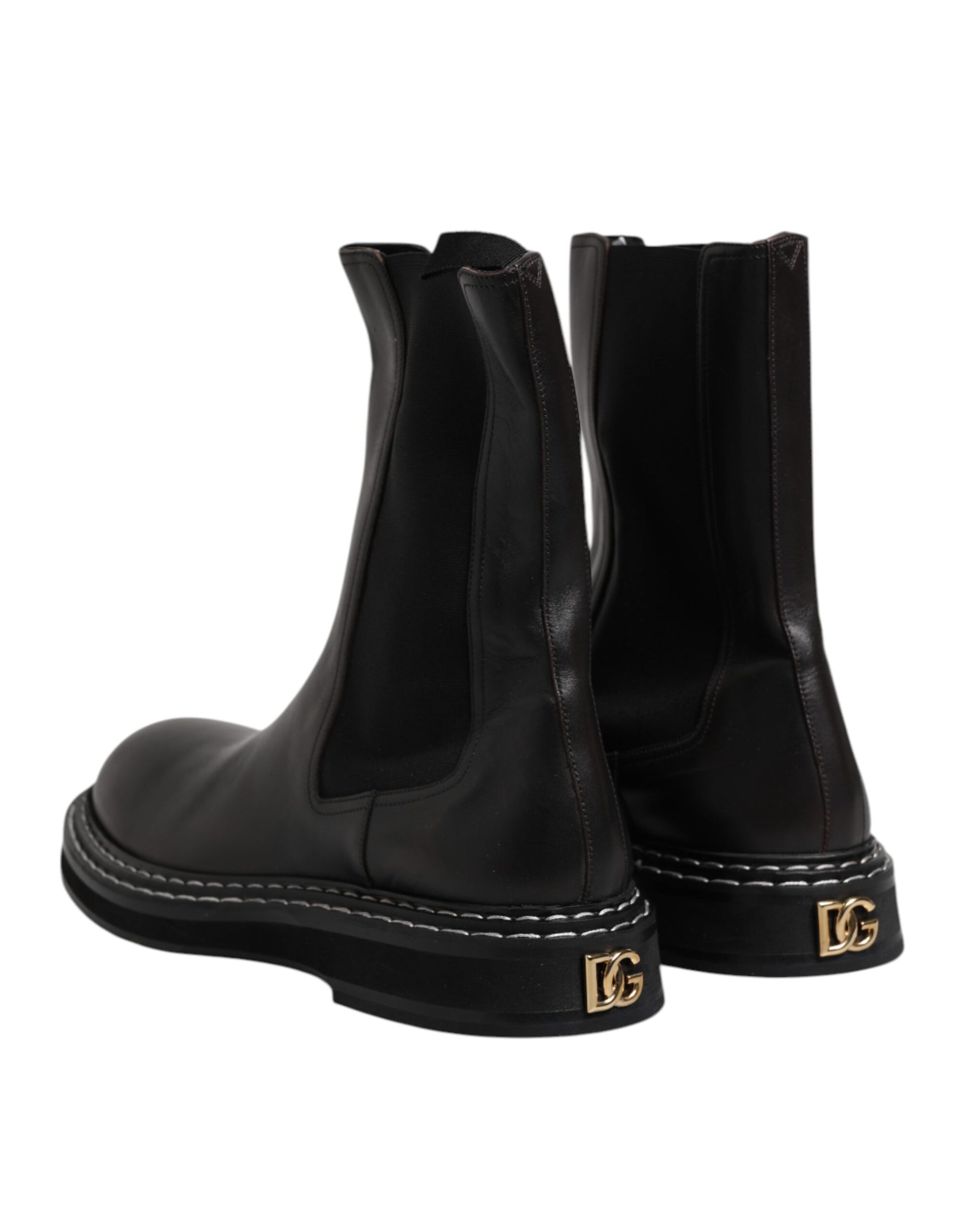 Pair of black leather boots with gold buckles