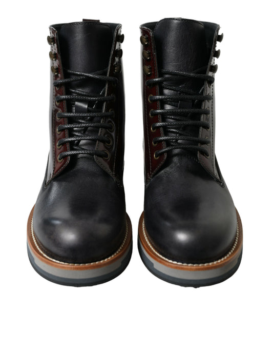 Pair of black leather boots with red laces and stitching details