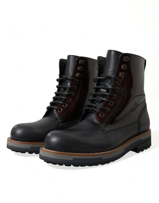 Pair of black leather boots with laces and metal eyelets