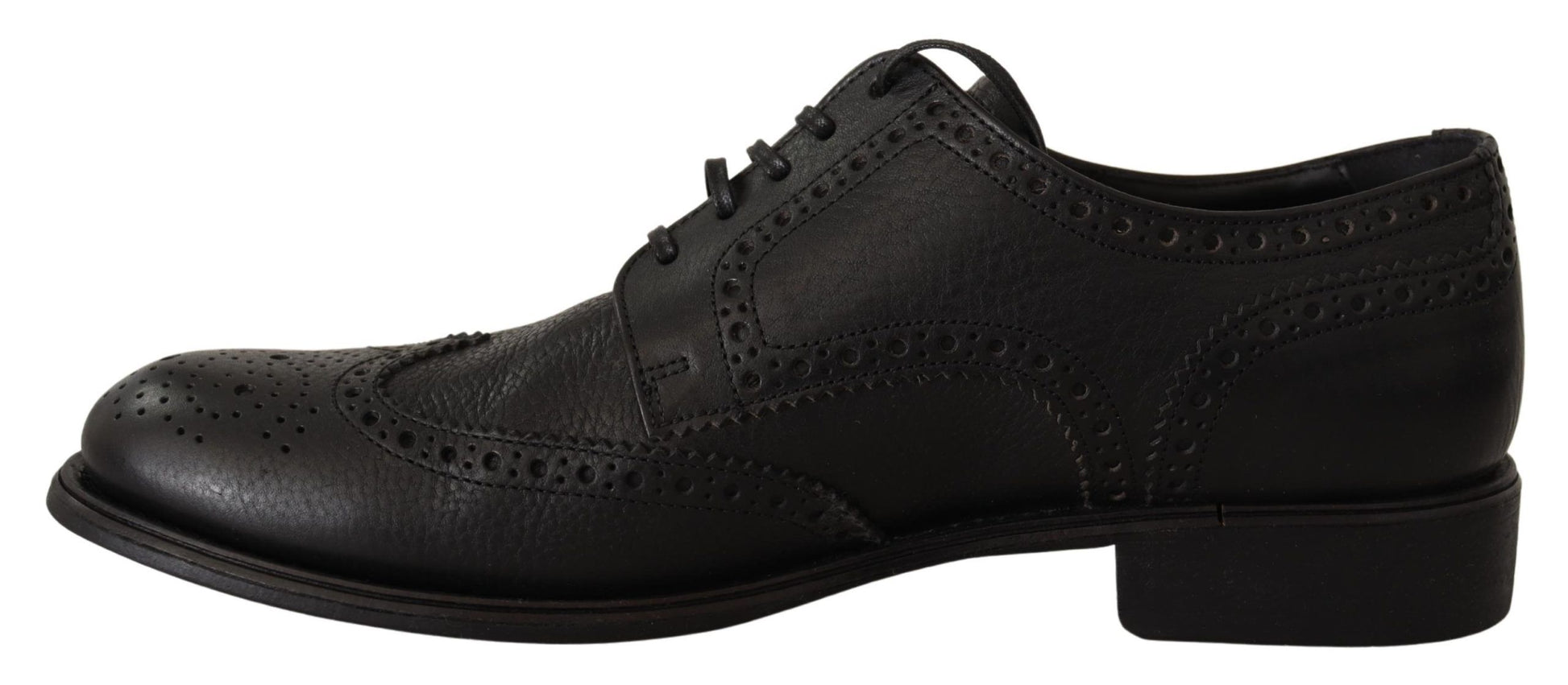 Black dress shoes with laces and embroidered details on top of each other