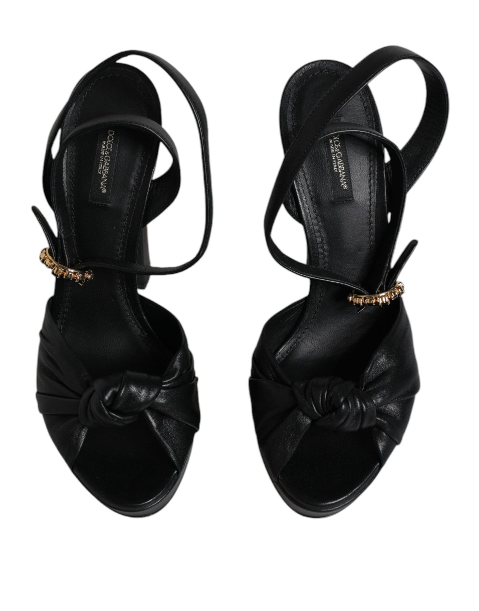 Pair of black strappy heels with gold accents
