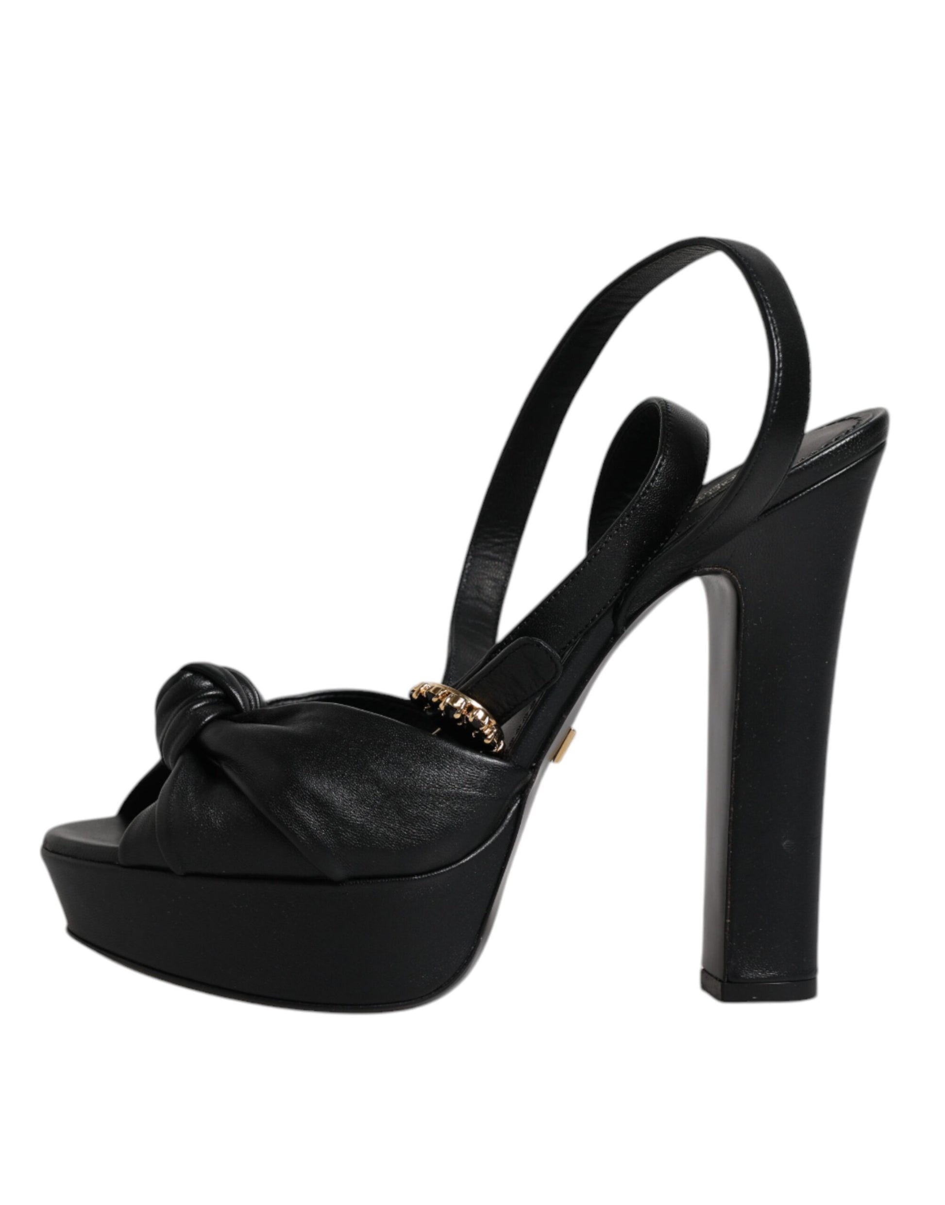 Black high heel shoe with strap over toe