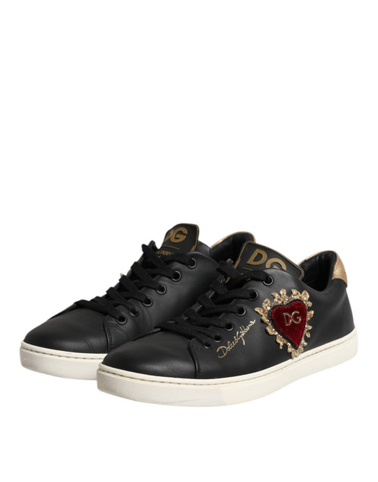 Black leather sneakers with gold accents, featuring a heart design on the side