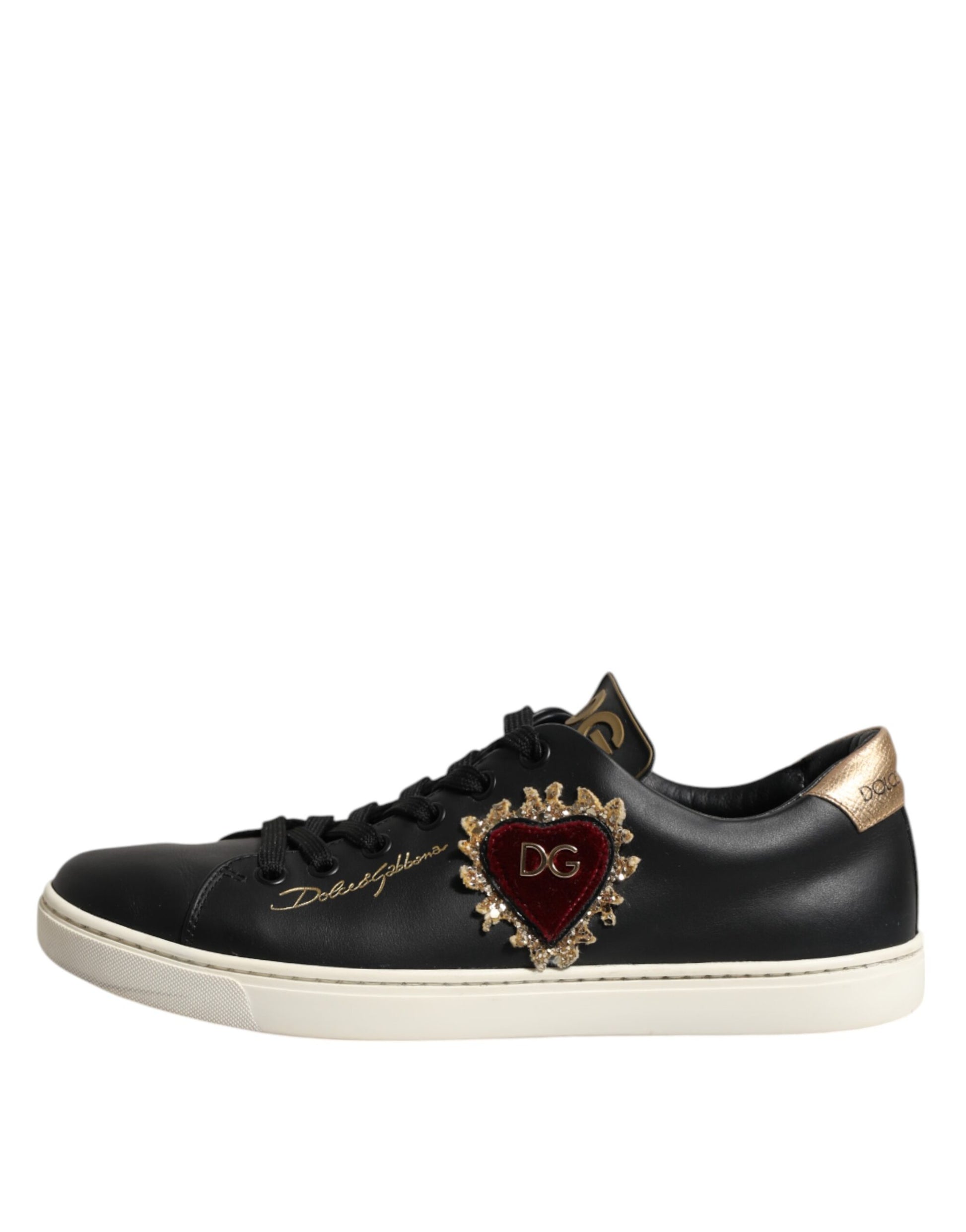 Black leather sneakers with gold accents, featuring a heart design on the side and the brand name