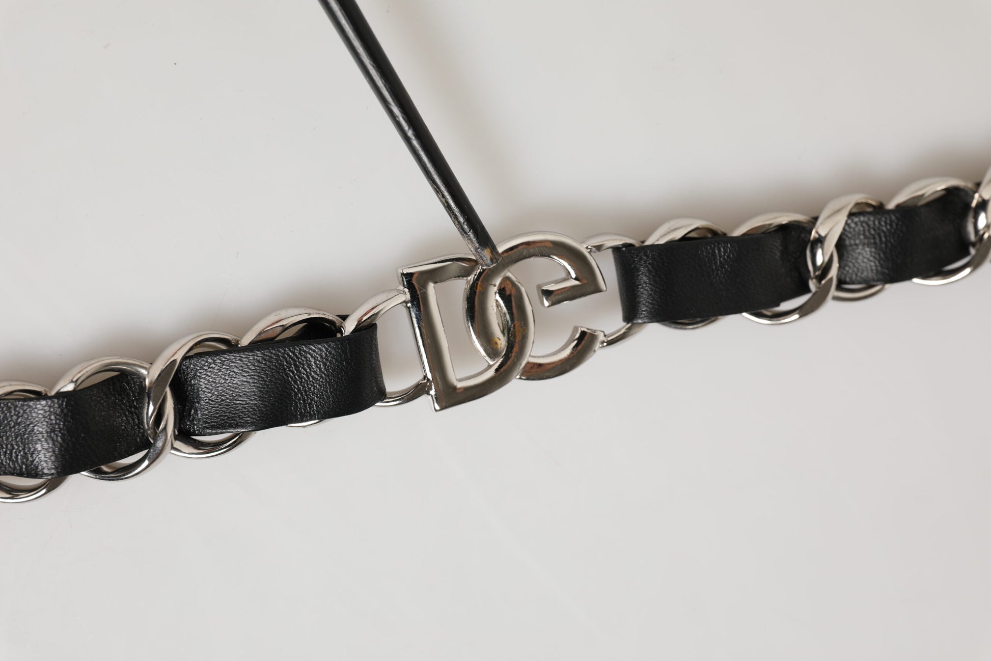 Black leather belt with silver buckle