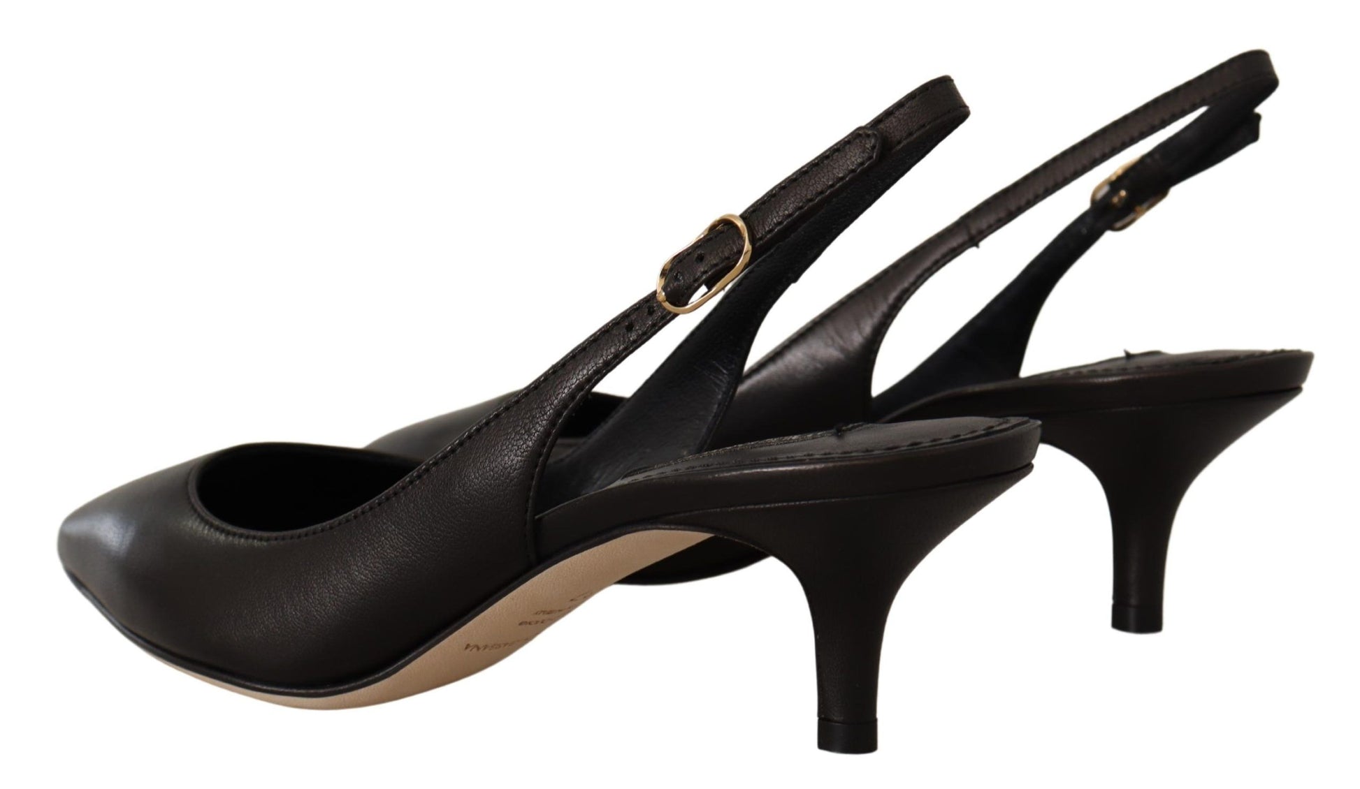 Pair of black high heel shoes with gold accents and straps