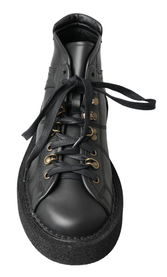 Black leather lace-up boot with gold eyelets and black laces