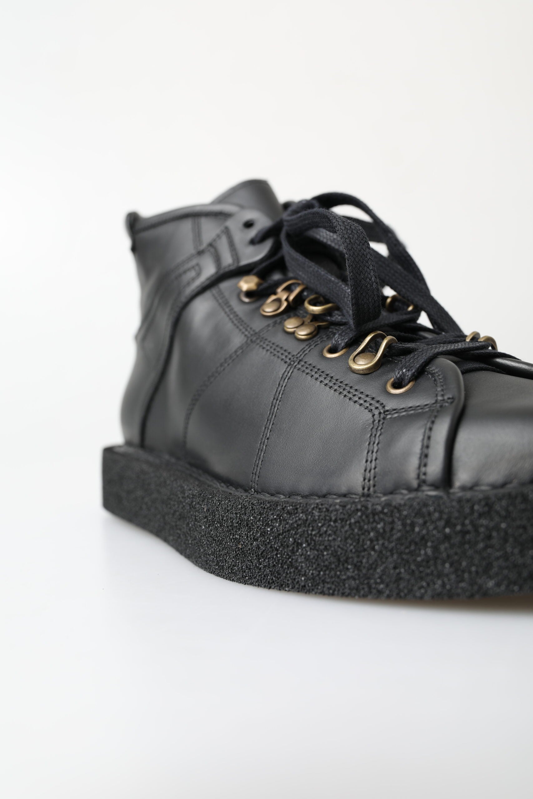 Black leather ankle boot with chunky sole and laces