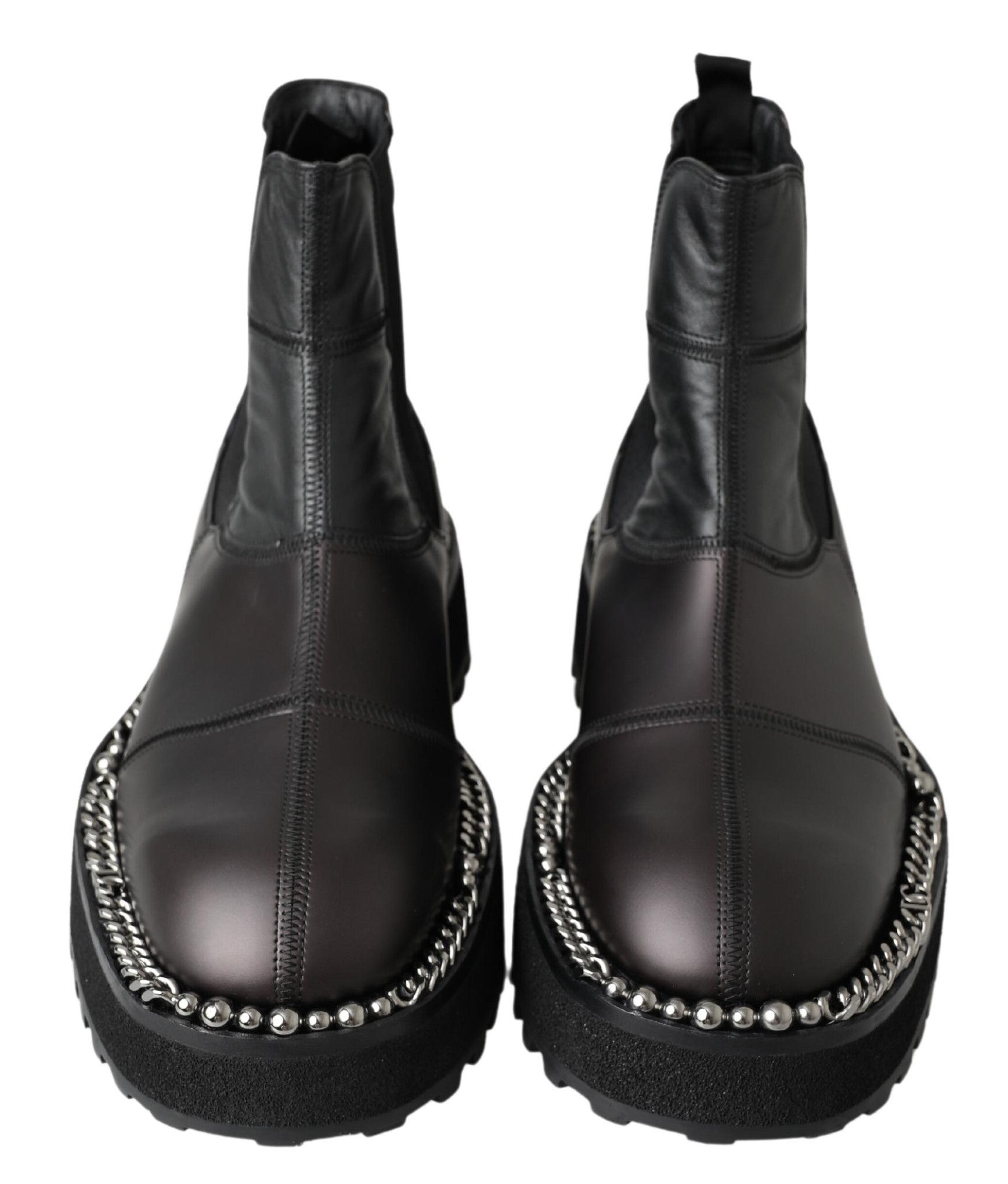 Pair of black leather boots with silver studs and a chunky heel