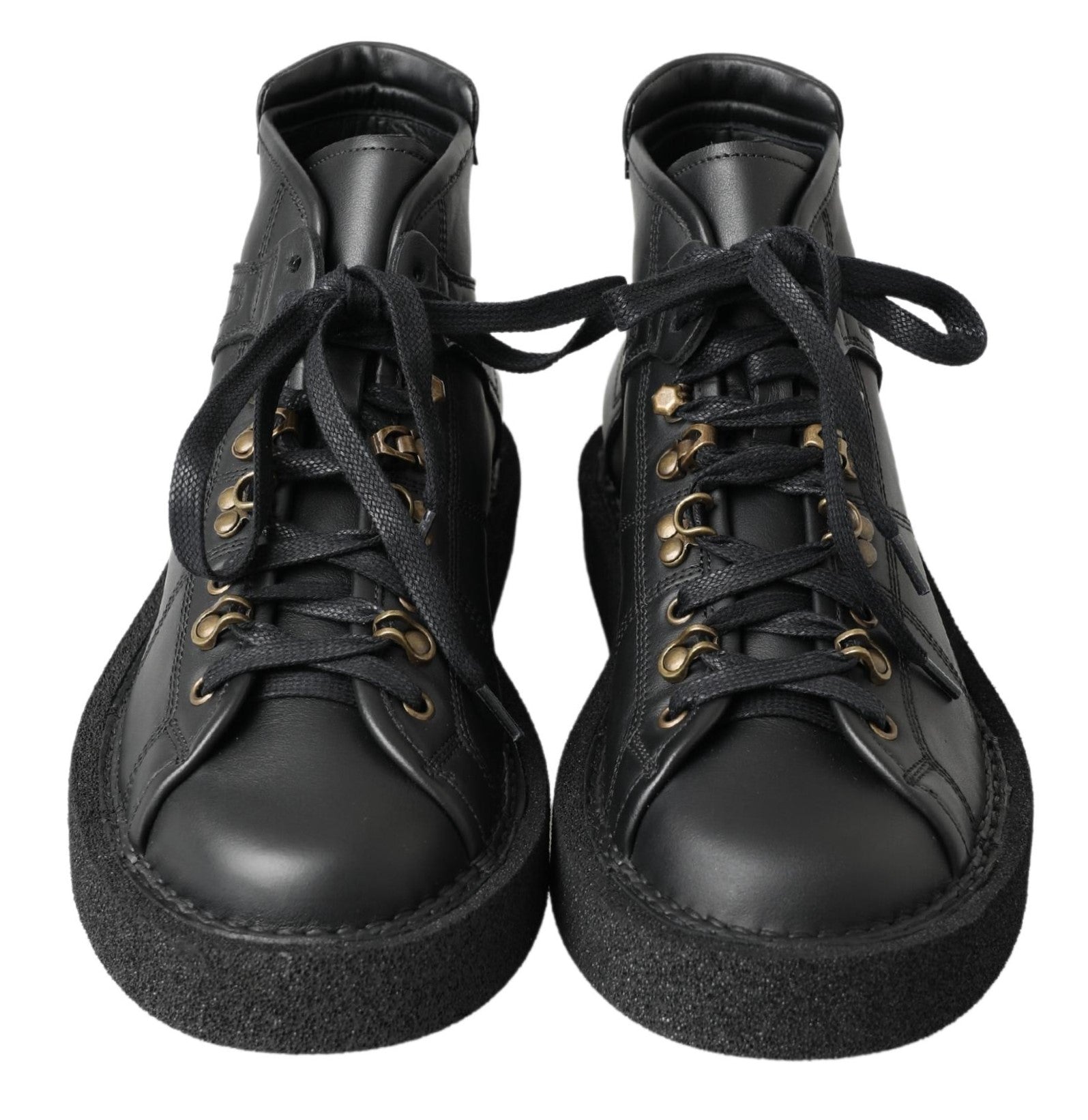 Pair of black leather boots with gold laces and a small heel