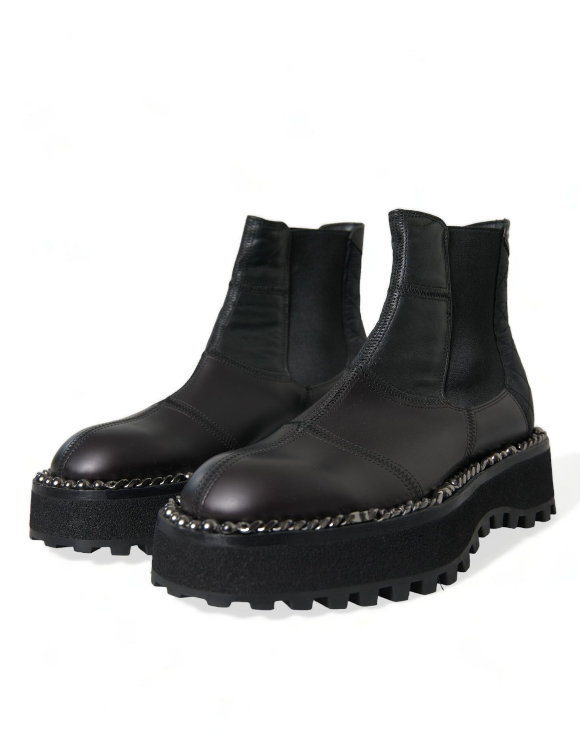 Pair of black boots with silver studs and a chunky sole