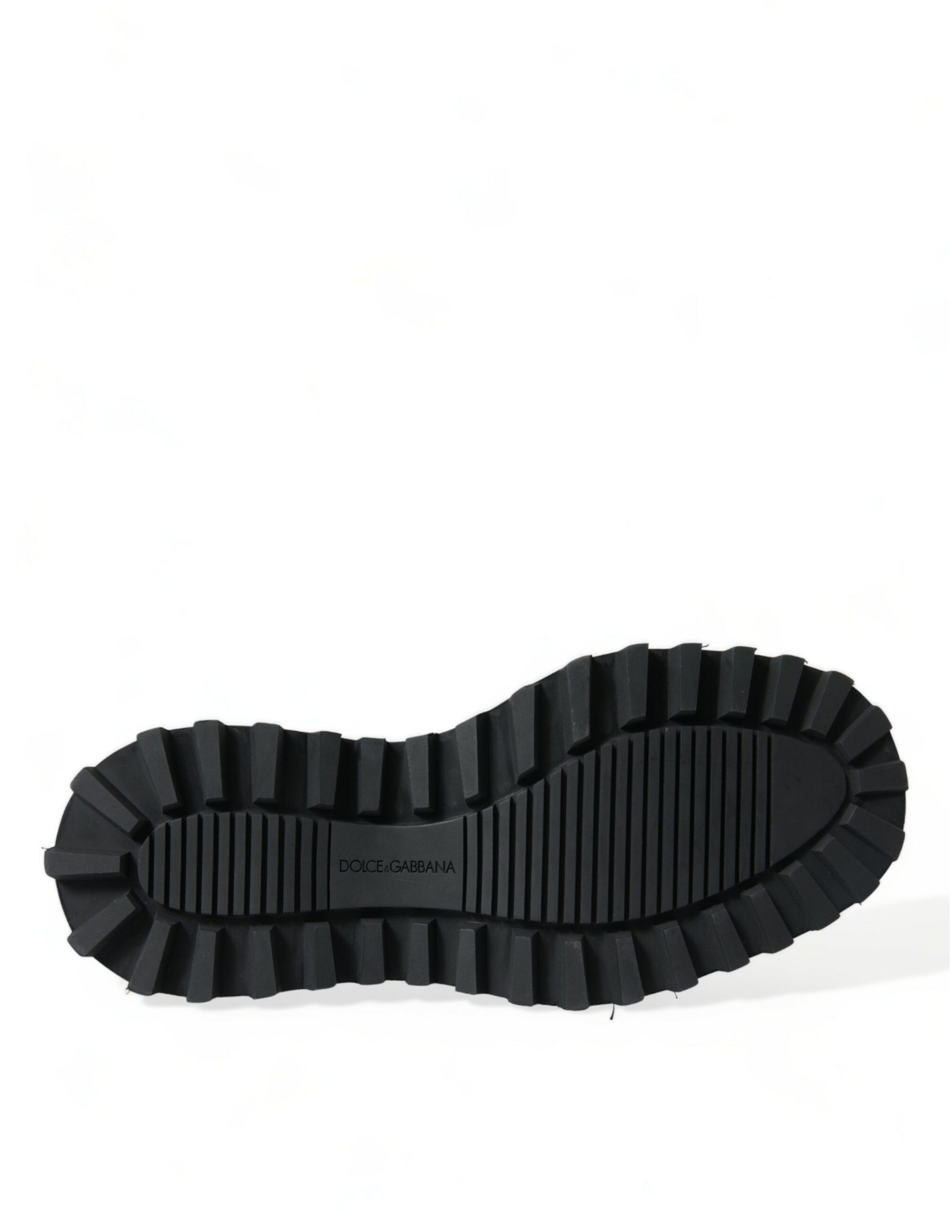 Black rubber hiking boot with deep treads and a pull tab on top
