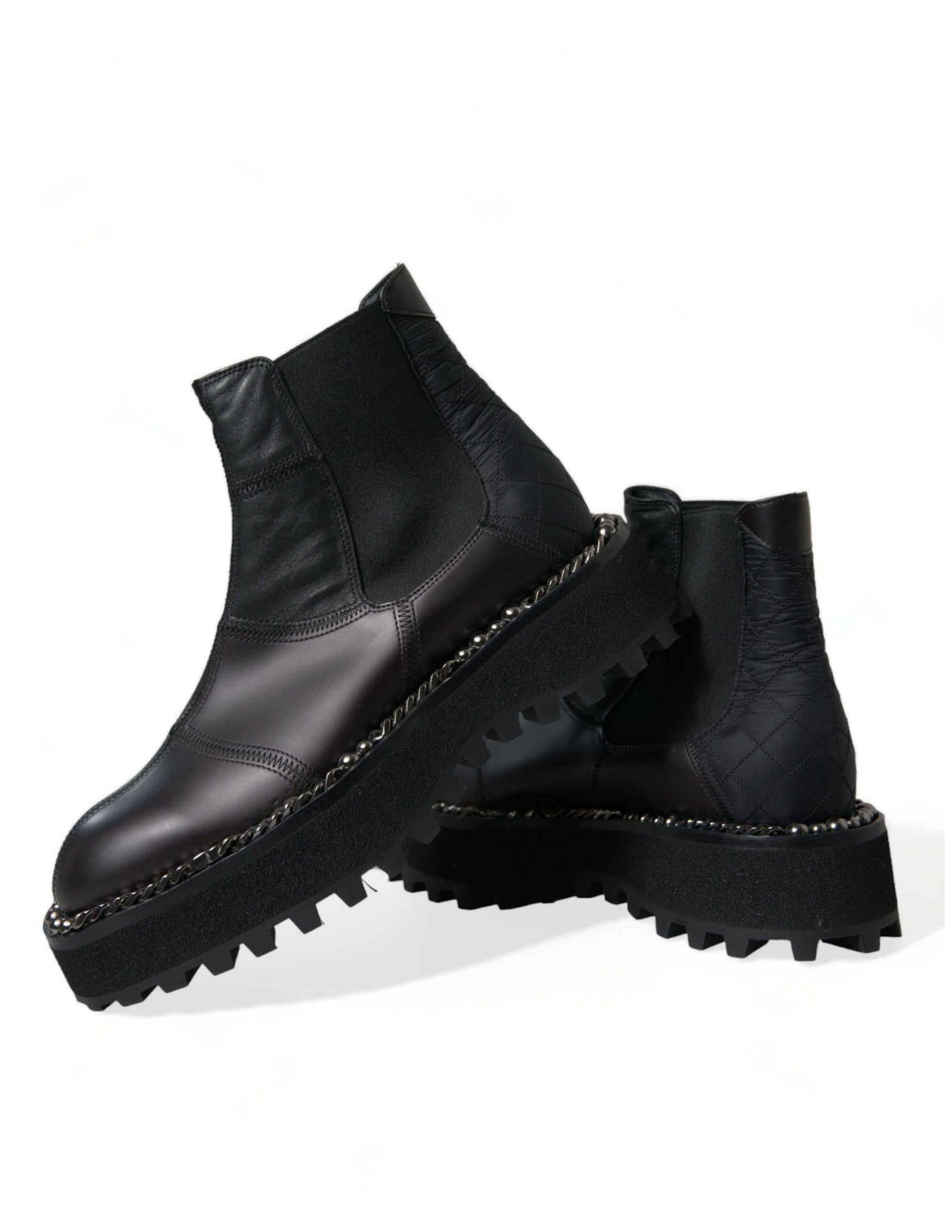 Pair of black leather boots with chunky soles and laces