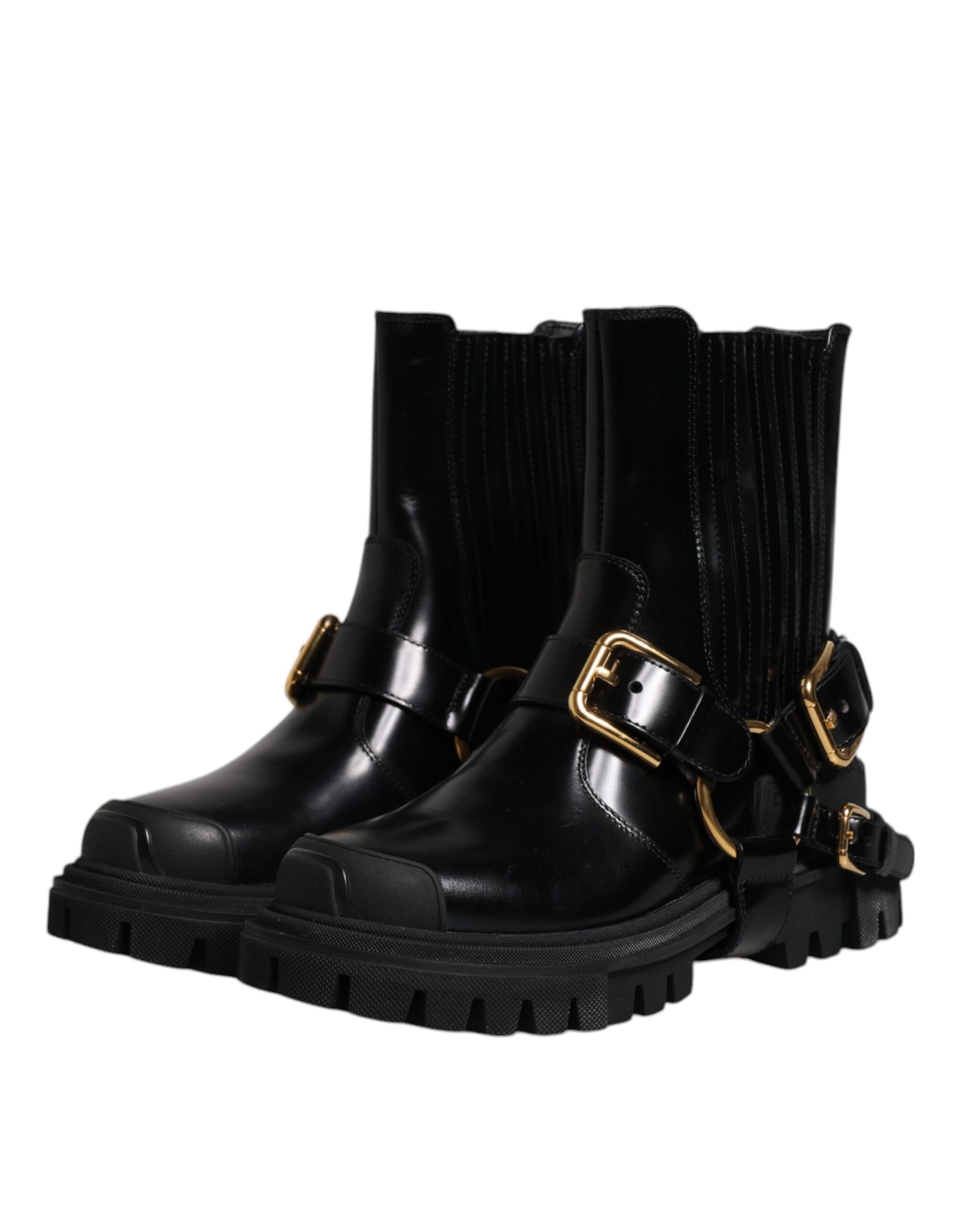 Black leather ankle boots with gold buckles