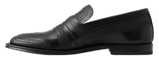 Pair of black dress shoes with a patterned design on the vamp and toe cap