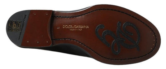 Pair of brown leather shoes with embossed logo on side