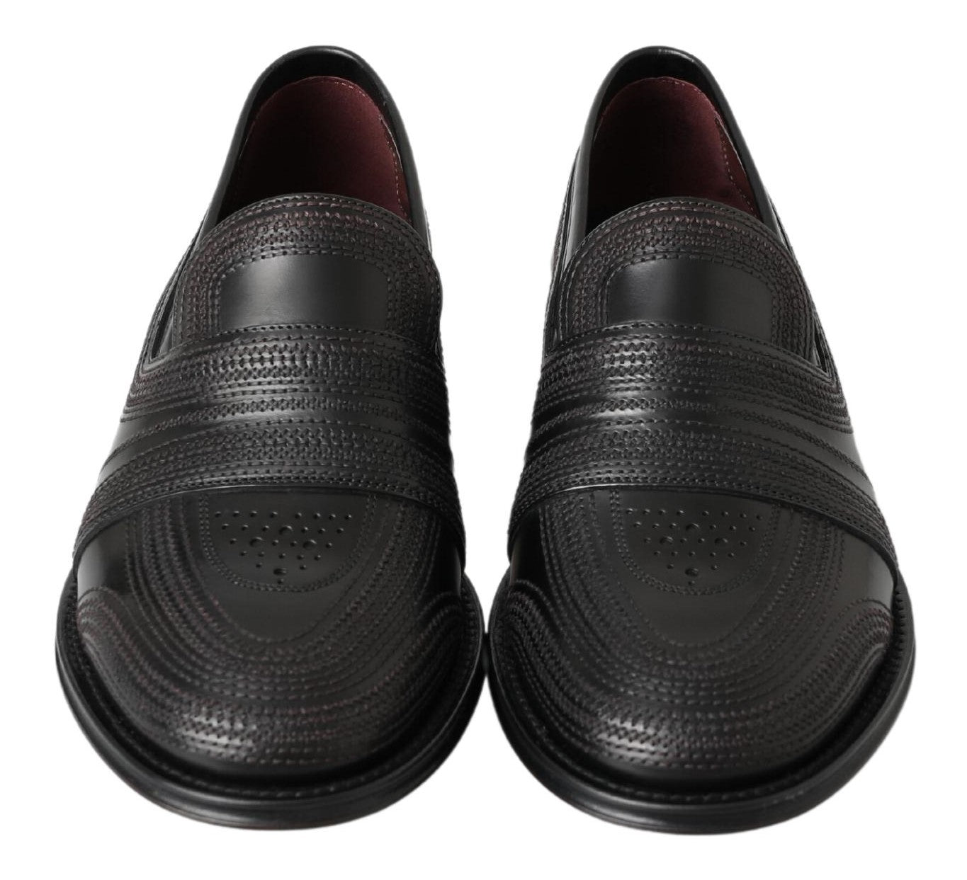 Pair of black loafers with a patterned sole