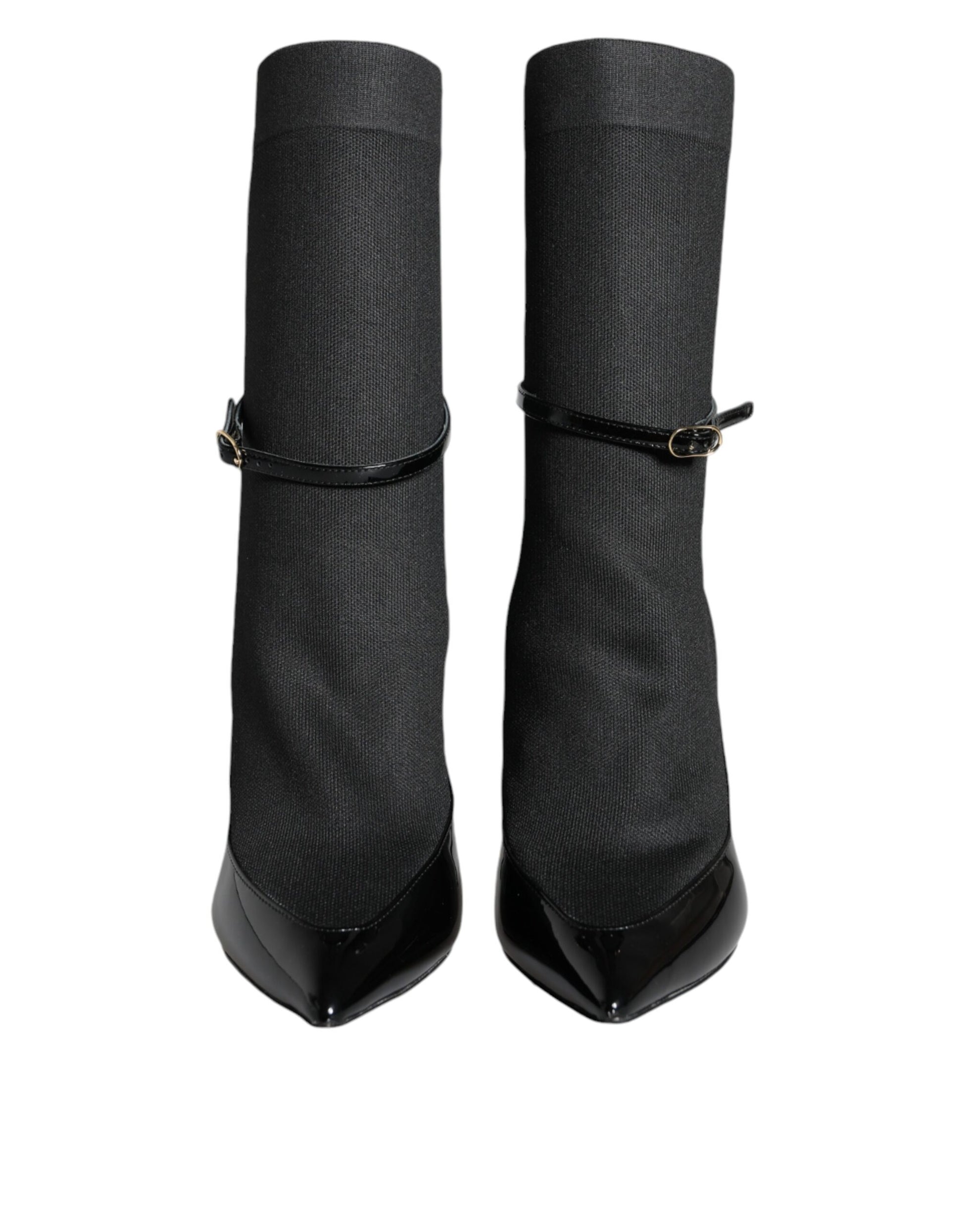 Pair of black knee high boots with buckles