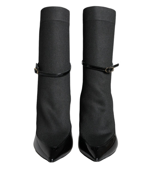 Pair of black knee high boots with buckles