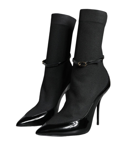 Pair of black knee high boots with heels