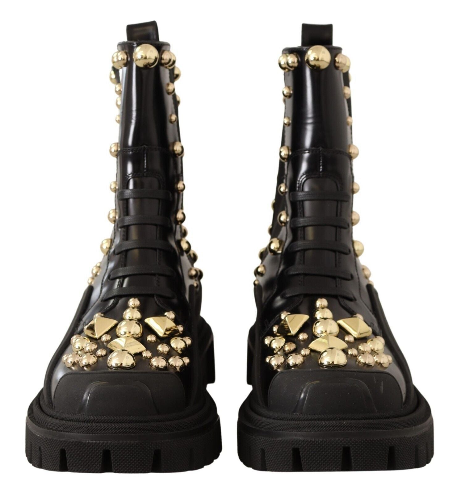 Pair of black boots with gold studs and buckles