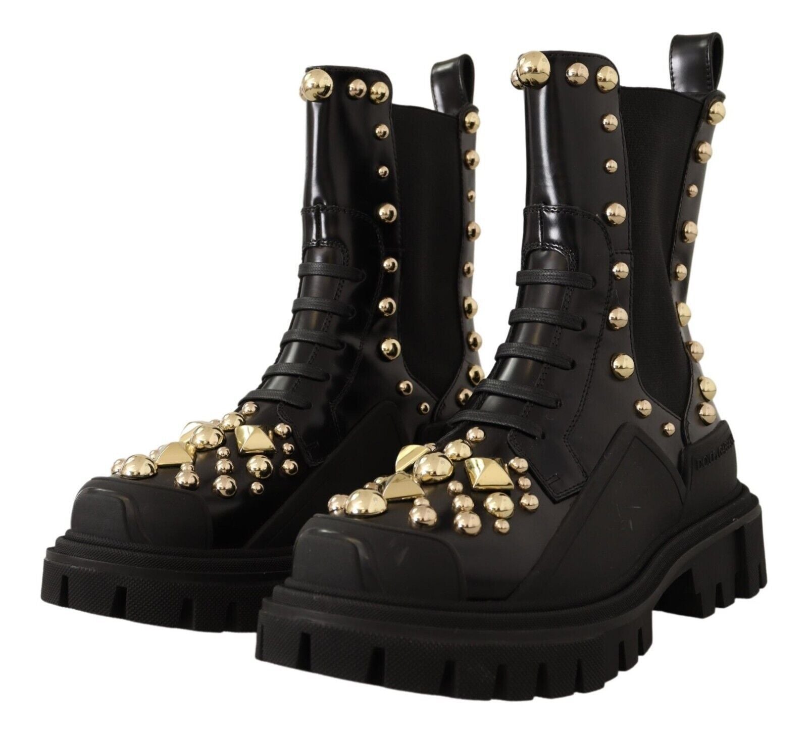 Pair of black boots with gold studs and buckles