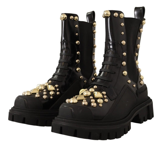Pair of black boots with gold studs and buckles