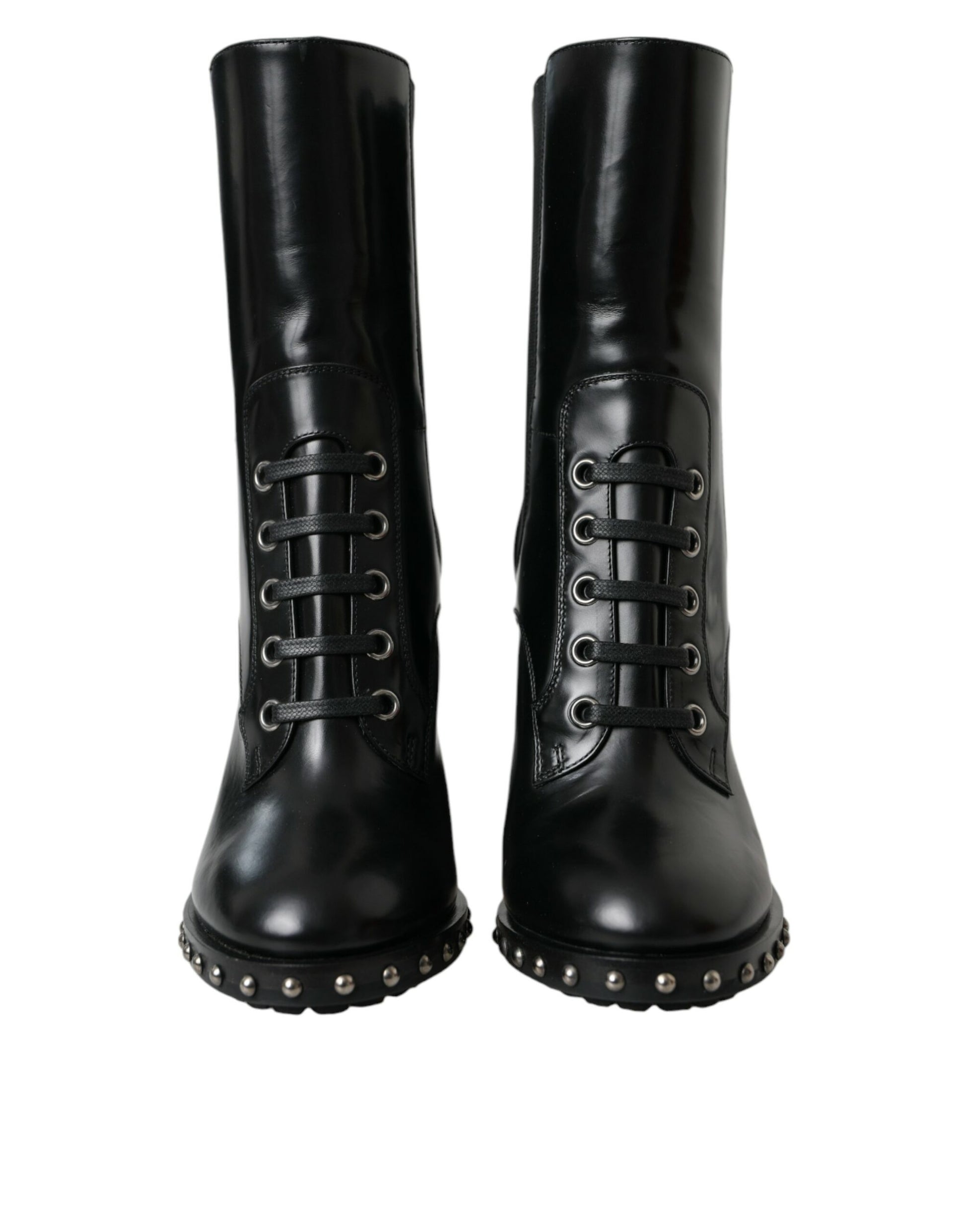 Pair of black leather boots with silver studs and laces