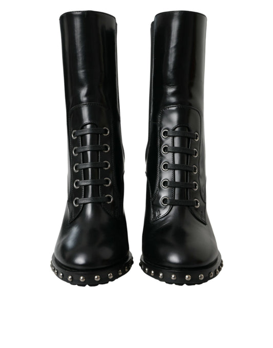 Pair of black leather boots with silver studs and laces