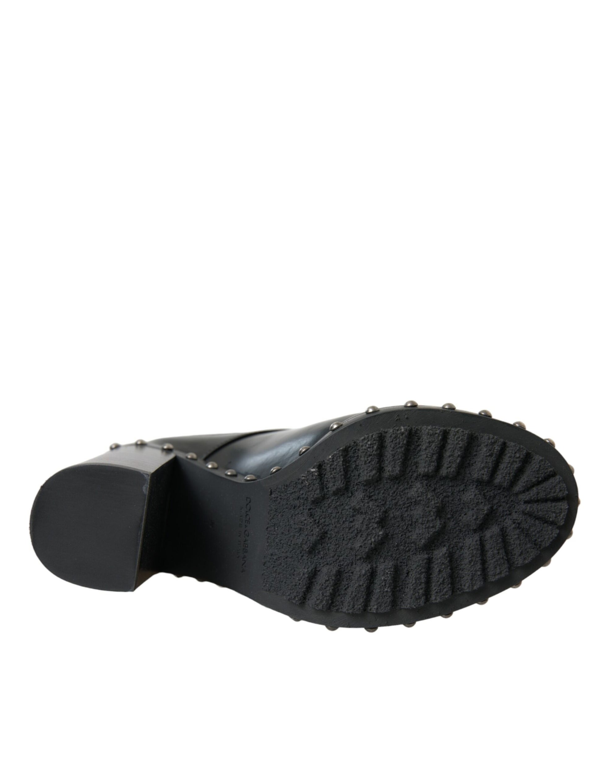 Black work boot with a deep tread pattern on the sole