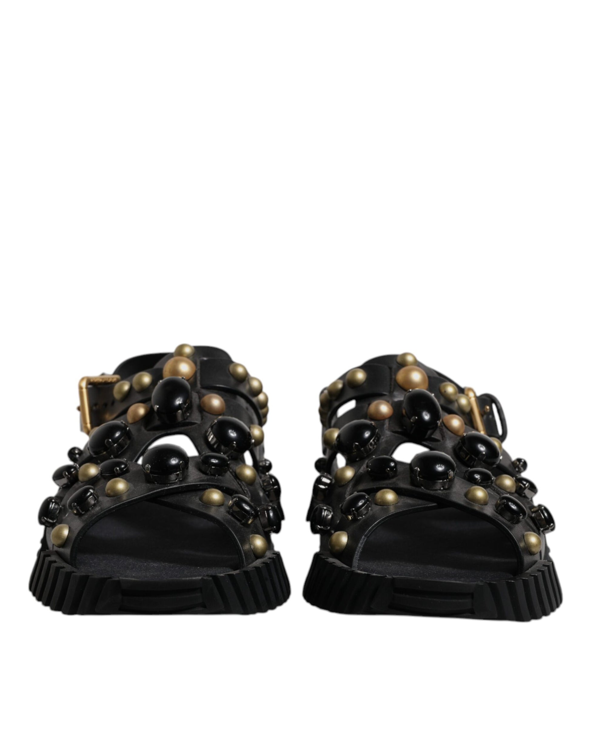 Pair of black sandals with gold accents