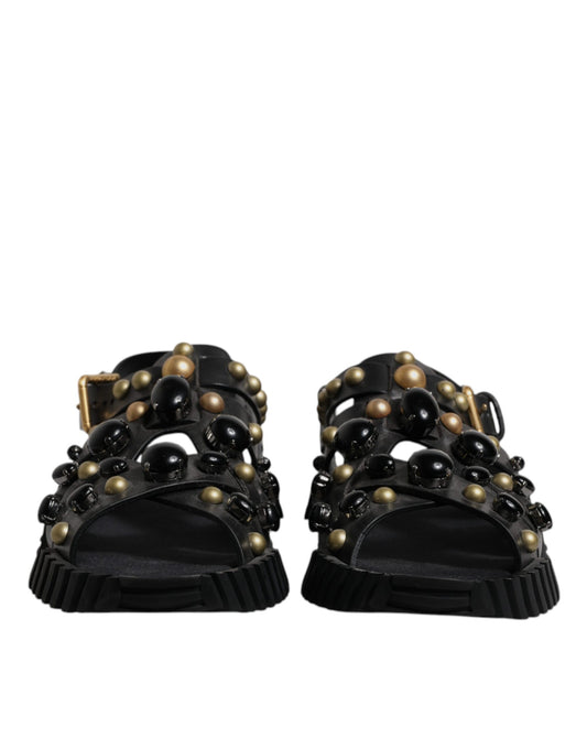Pair of black sandals with gold accents