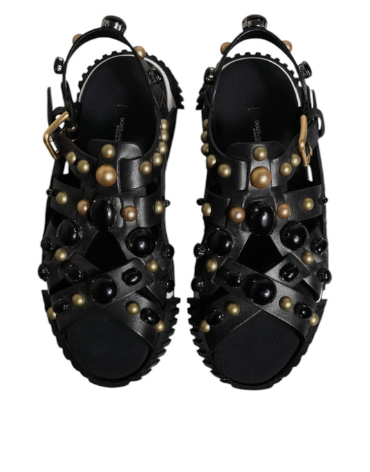 Pair of black sandals with gold beads