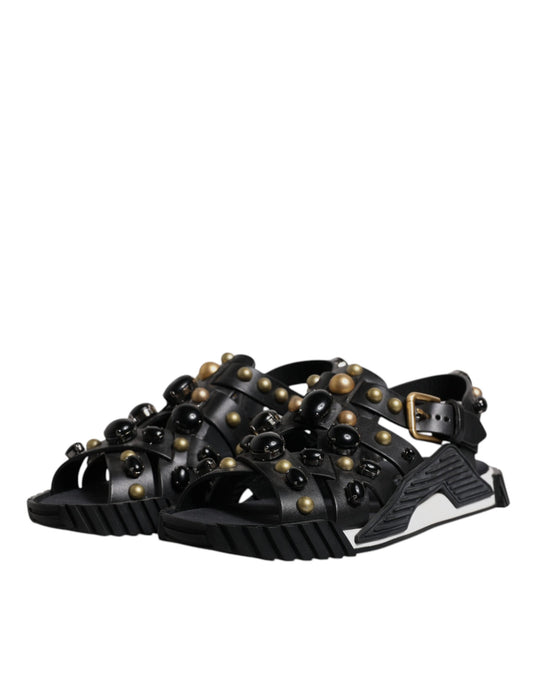 Black sandals with gold studs on straps
