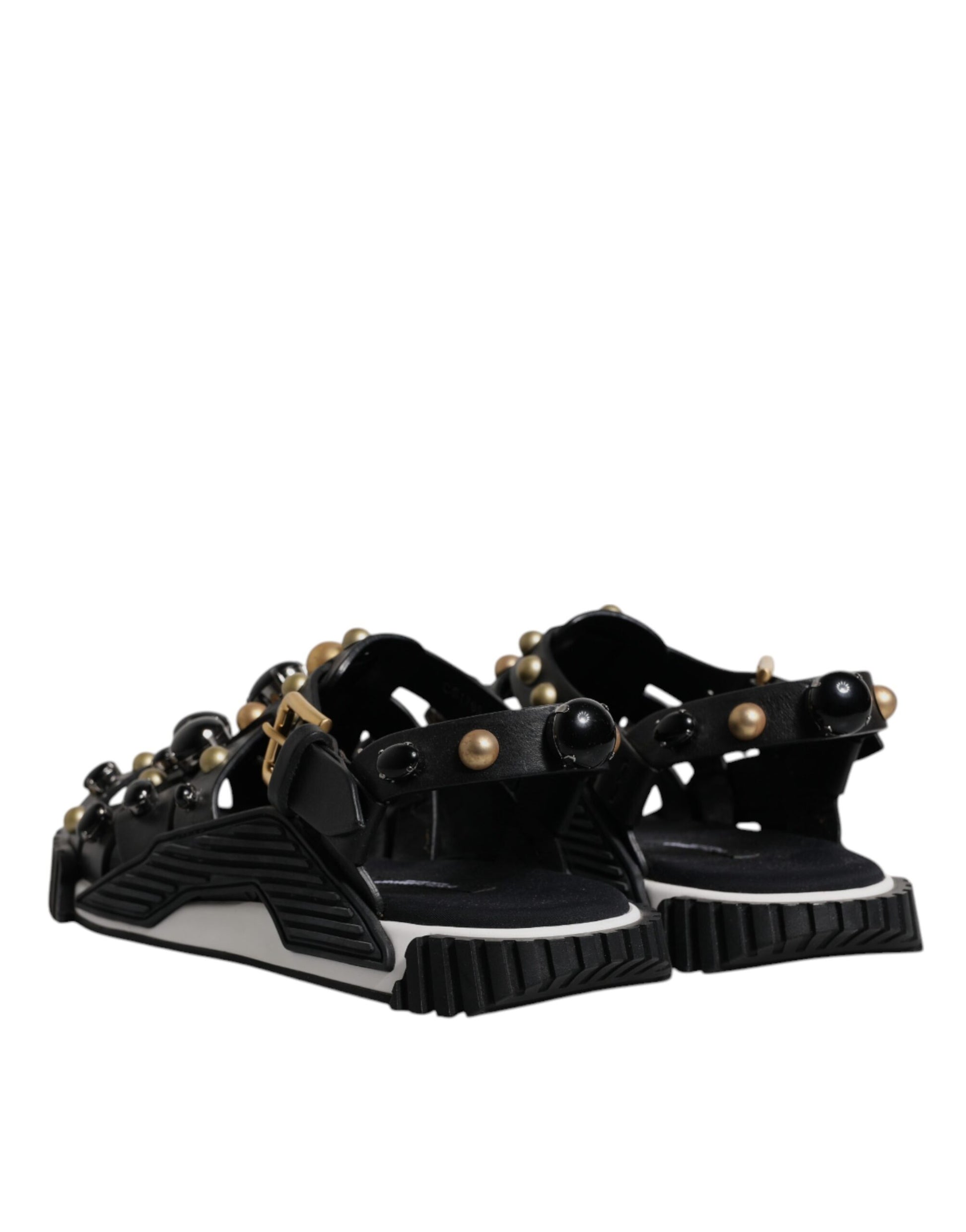 Pair of black sandals with gold accents
