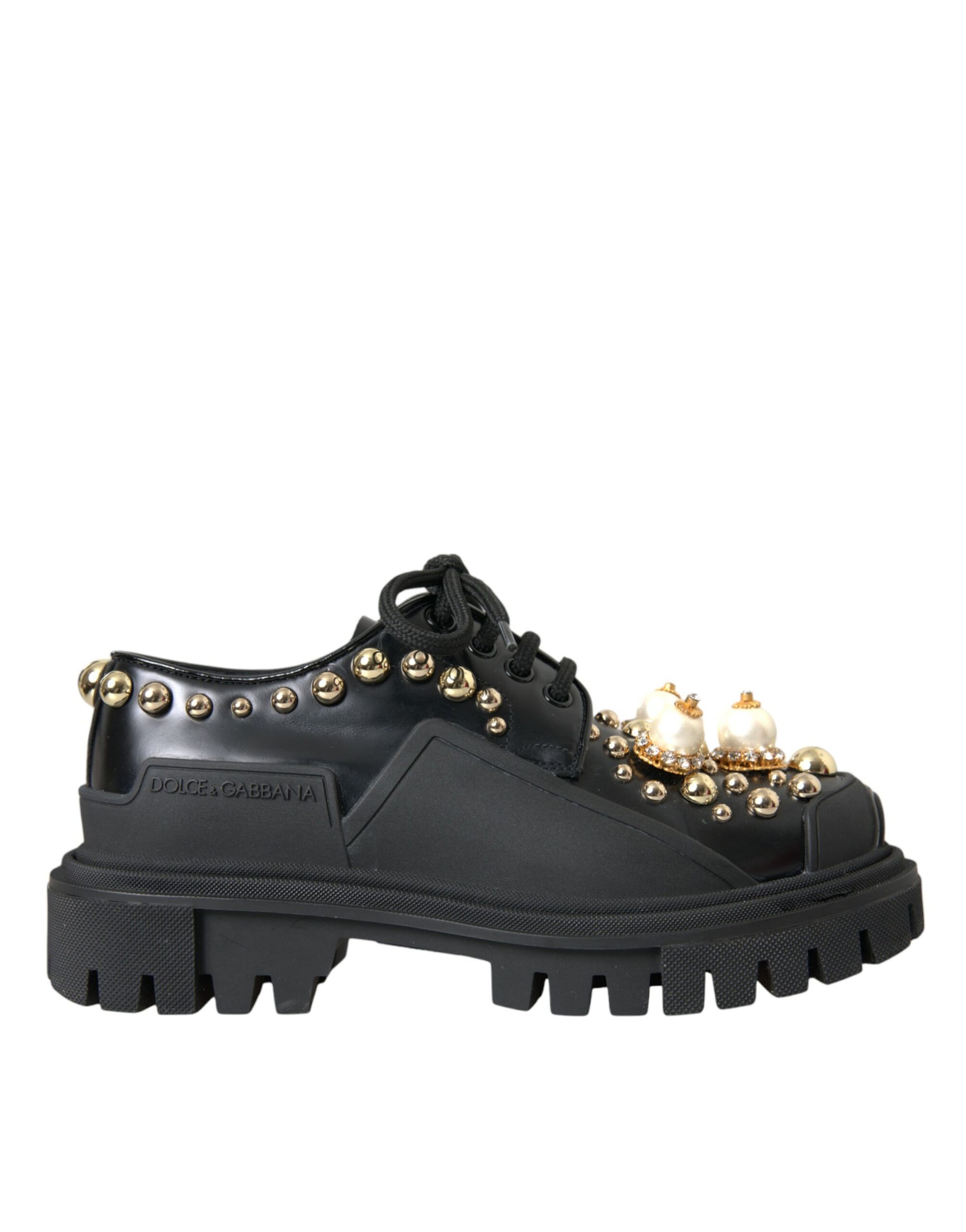 Black ankle boot with gold studs and a chunky sole