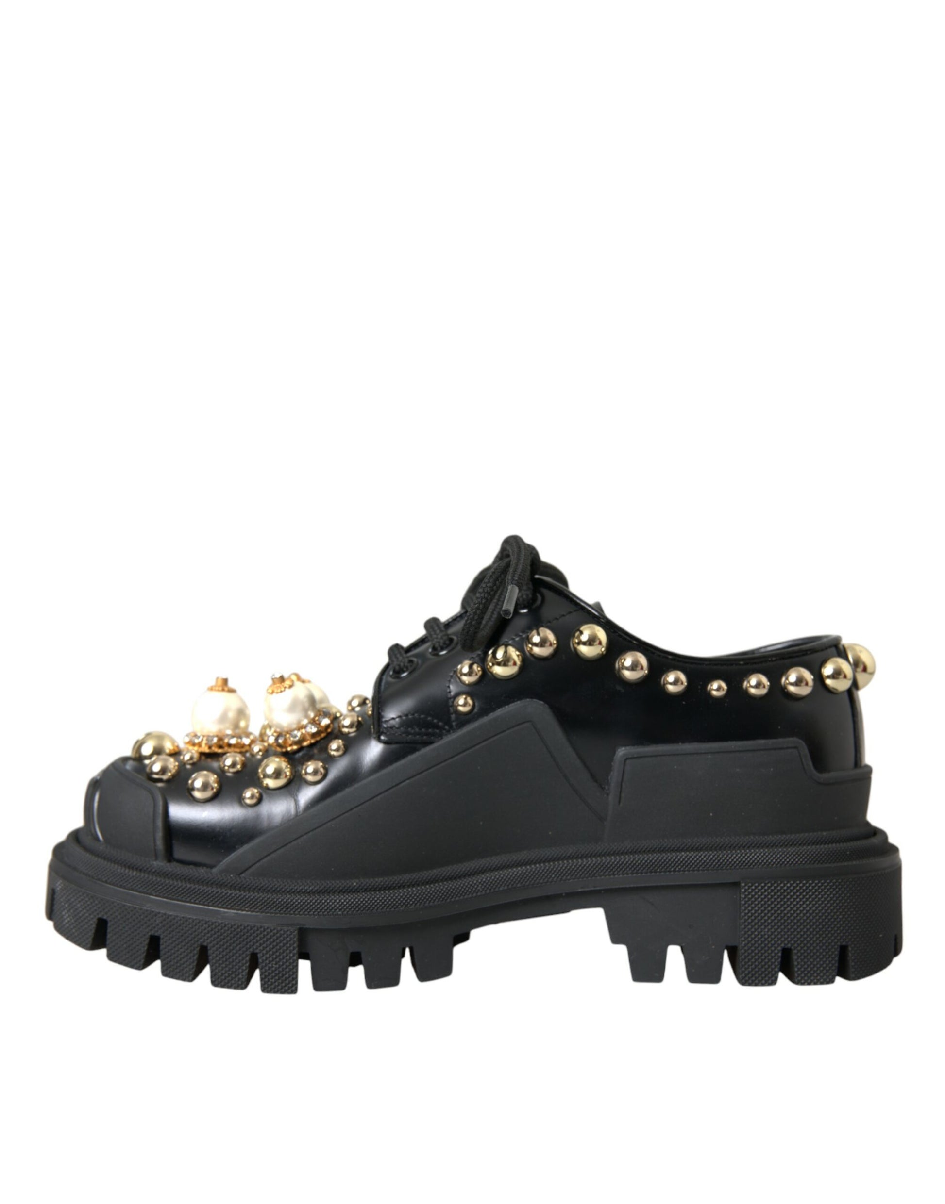 Black children's shoe with gold studs and a buckle closure