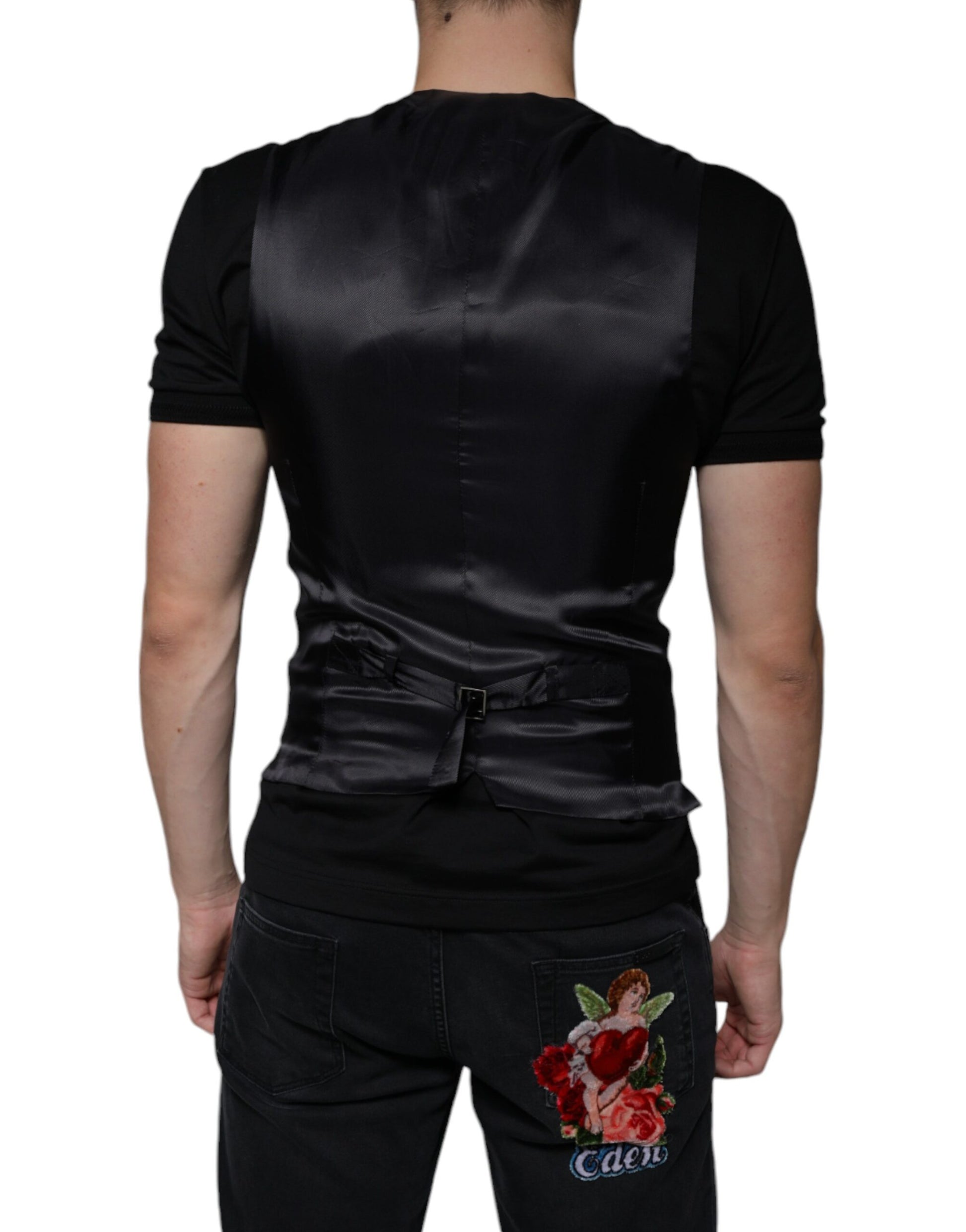 A black leather waistcoat with a rose embroidered on the back